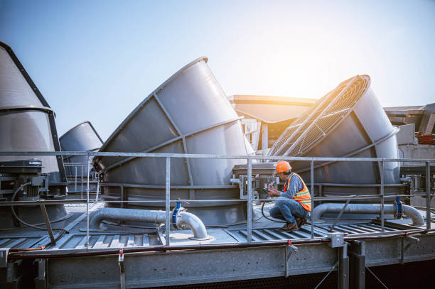 engineer under checking the industry cooling tower air conditioner